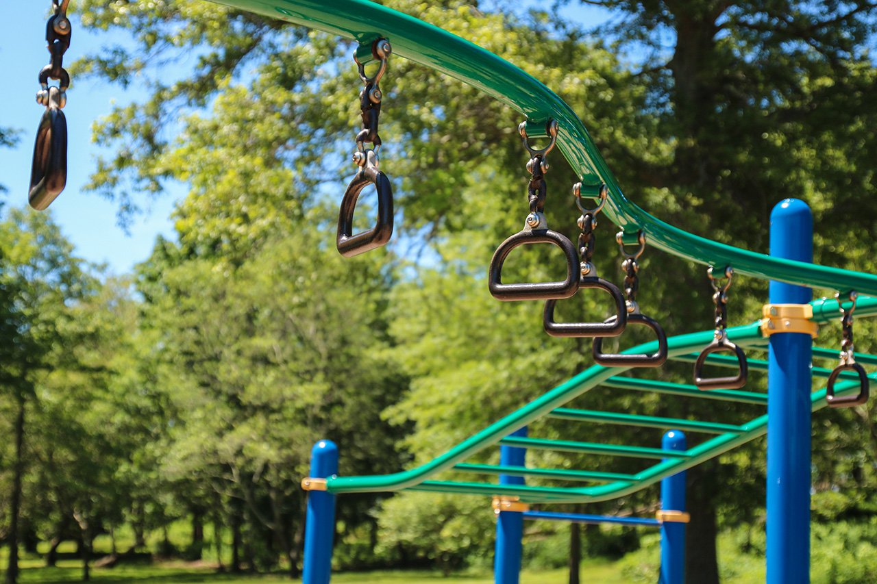 monkey bars and rings at the jungle gym playground.